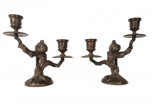 A pair of candelabra with sleeping feasants, by Antoine-Louis Barye.