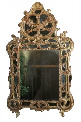 A Louis XV mirror, with attributes of the goddess Artemis