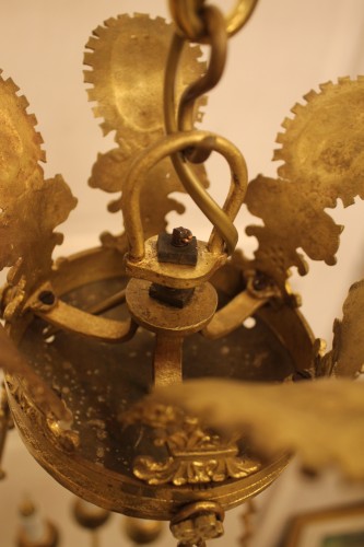 Antiquités - Lustre d'époque empire à neuf feux en bronze doré et laqué