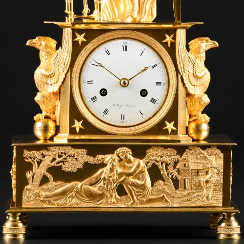 Horlogerie Pendule - Pendule de cheminée Empire en bronze doré “L’épinettiste”