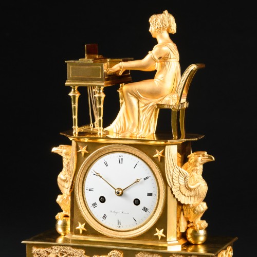 Empire - Empire gilt bronze mantel clock “L’épinettiste”