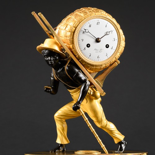Empire Clock Le Portefaix After Design By Jean-André Reiche - 