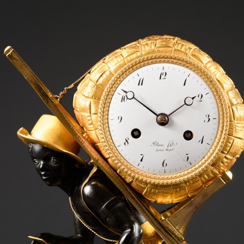 Empire Clock Le Portefaix After Design By Jean-André Reiche - Empire