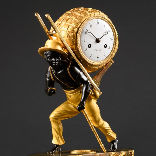 Empire - Empire Clock Le Portefaix After Design By Jean-André Reiche