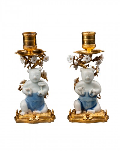 Pair of bronze and Chinese porcelain candlesticks, Regence period
