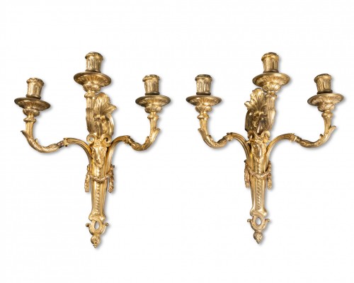 Pair of three-arm bronze wall sconces, Paris, Louis XVI period