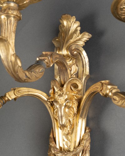 Lighting  - Pair of three-arm bronze wall sconces, Paris, Louis XVI period