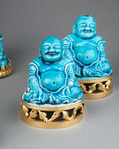 Porcelain & Faience  - Collection of eight turquoise-glazed biscuit porcelain figures of Budai, Ch