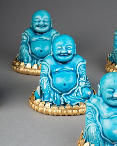 Collection of eight turquoise-glazed biscuit porcelain figures of Budai, Ch - Louis XIV