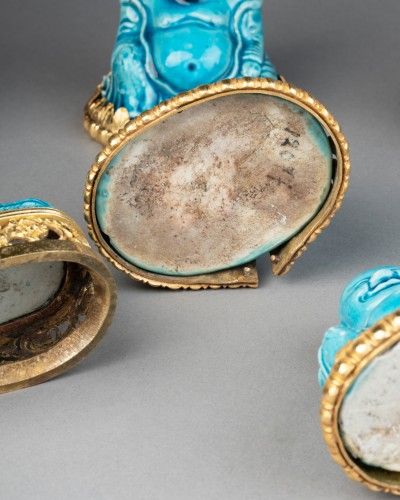 Louis XIV - Collection of eight turquoise-glazed biscuit porcelain figures of Budai, Ch