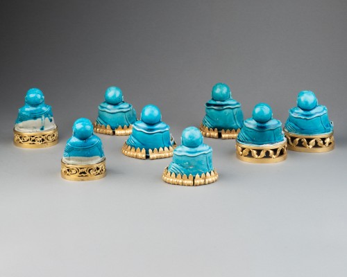Antiquités - Collection of eight turquoise-glazed biscuit porcelain figures of Budai, Ch