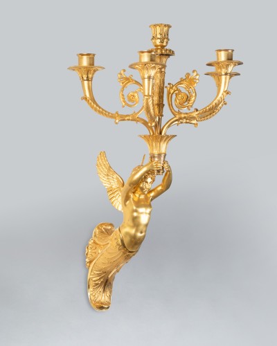 Antiquités - Pair of wall lights featuring winged children, Paris, Empire period