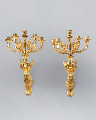 Antiquités - Pair of wall lights featuring winged children, Paris, Empire period