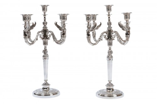 A French Empire pair of solid silver combinable candelabras