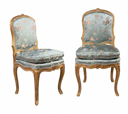 A Louis XV pair of giltwood chairs