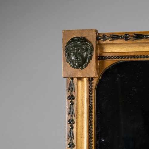 Mirror in gilded and patinated wood. - 