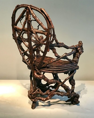 Seating  - Extraordinary armchair composed of an assembly of branches of wood.