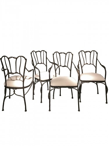 Set of four black iron armchairs