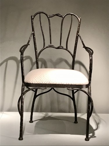 XXe siècle - Série de quatre fauteuils en fer noirci