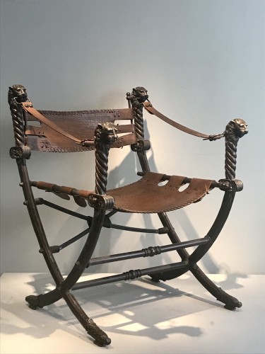 Antiquités - Curule chair, French work of the 1920s.