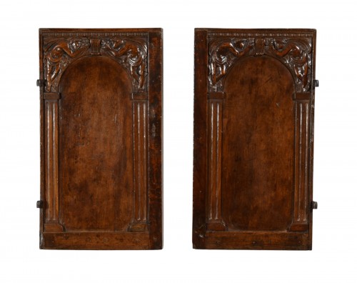 Pair of small carved walnut doors, 16th century central Italy