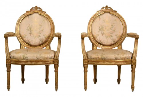 Pair of Neoclassical armchairs, lacquered gilt wood, Italy 18th century