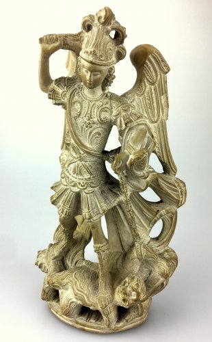 Antiquités - A carved lava stone figure of St.Michael.17th century.