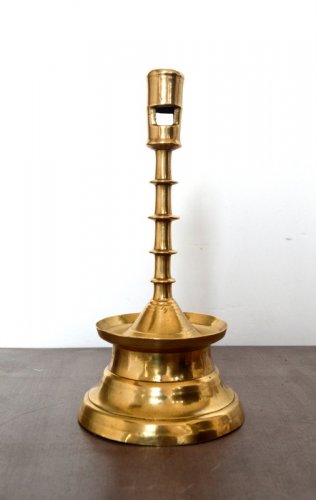 Lighting  - A Gothic brass Candlestick.Late 15th century.