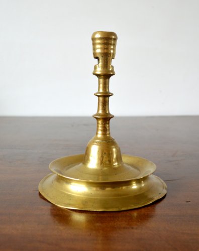 Lighting  - A Gothic brass Candlestick.Late 15th century.