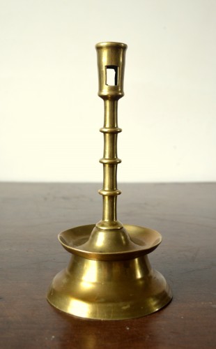 Lighting  - A Gothic brass Candlestick.Late 15th century.