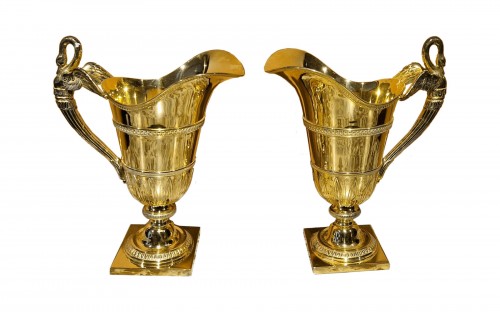 A pair of French silver-gilt ewers