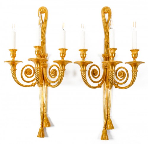 A pair of gilt bronze three light scones