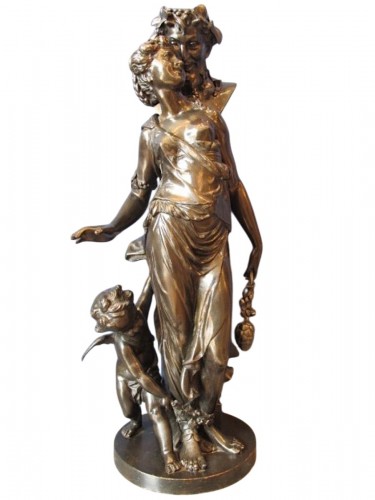 A 19th-century bronze sculpture depicting a Bacchanalian scene.