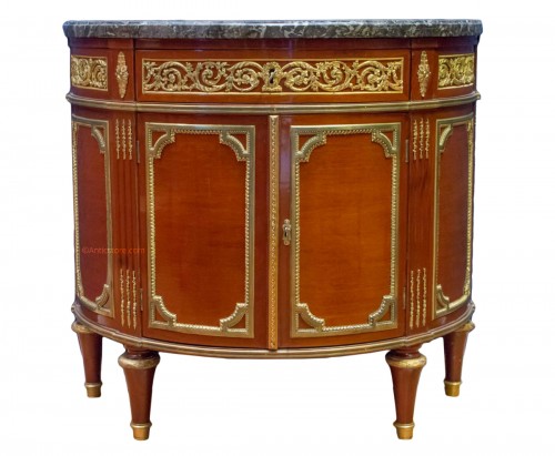 A Louis XVI style mahagony demi-lune commode