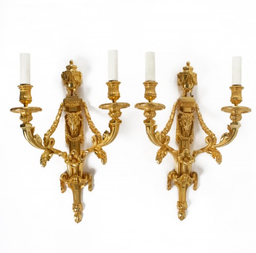 A Louis XVI style pair of wall lights