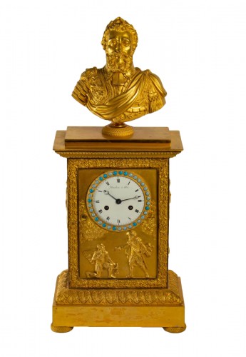 A Restauration period clock with a bust of the king Henri IV