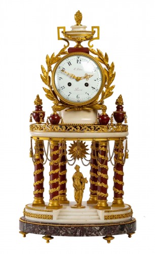 A white marble and gilt bronze clock