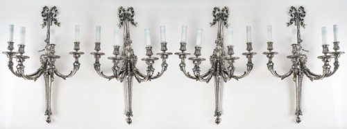  - Suite de quatre appliques en bronze argenté