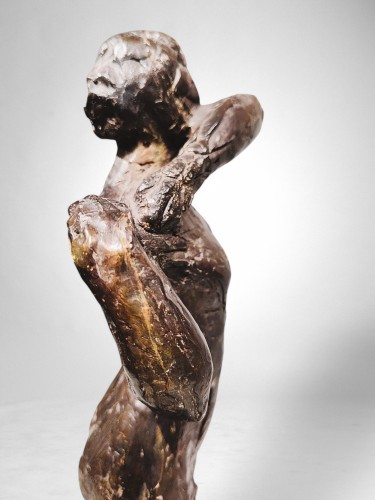  - Dancer fastening the shoulder strap of her bodice – Edgar Degas, bronze cas