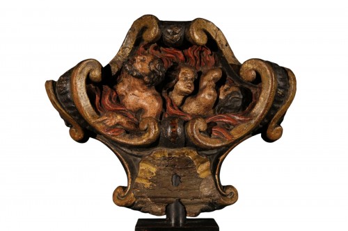 Top of a processional stick in polychrome wood dated 1736.