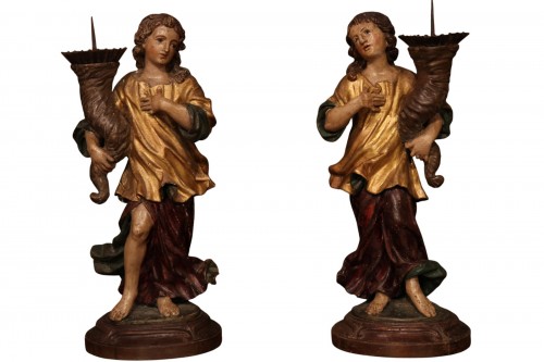 Pair of gilded and polychrome wood torchbearer angels late 17th century