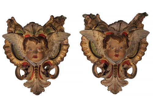 Pair of polychromed cast iron winged angel heads