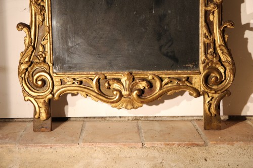 From Provence. 18th C large mirror in carved, gilt and lacquered wood. - 