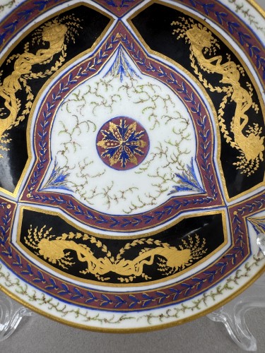Porcelain & Faience  - A Sèvres (hard paste) porcelain cup and saucer, black and mauve ground