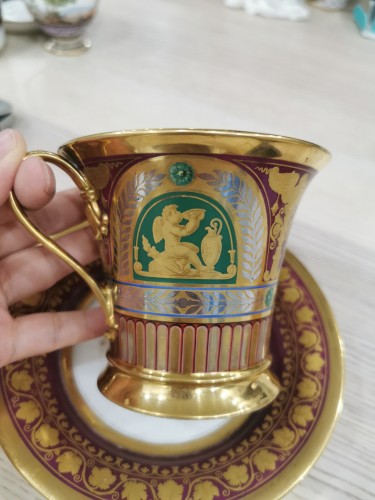 Porcelain & Faience  - Sèvres &quot;Three Gilt Cameo Putti&quot; Cup and Saucer Set