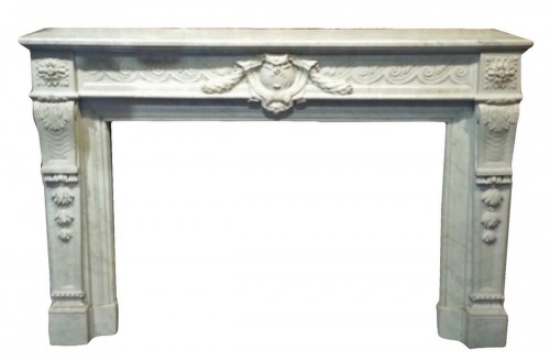 A Louis XVI style marble firemantle