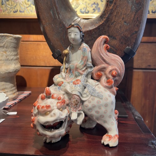 Asian Works of Art  - Japanese Kutani porcelain of Kannon riding a Shishi, 19th century