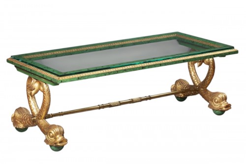 A gilt-bronze mounted glass coffee table with dolphin legs