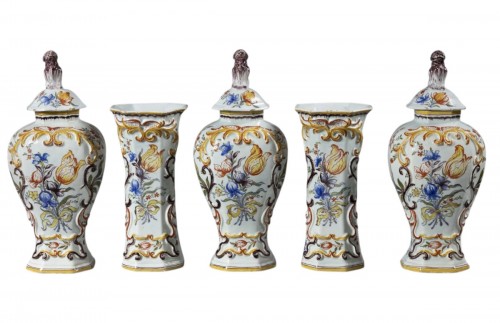 A Dutch Delft Polychrome five-piece vase garniture decorated with Dutch tul