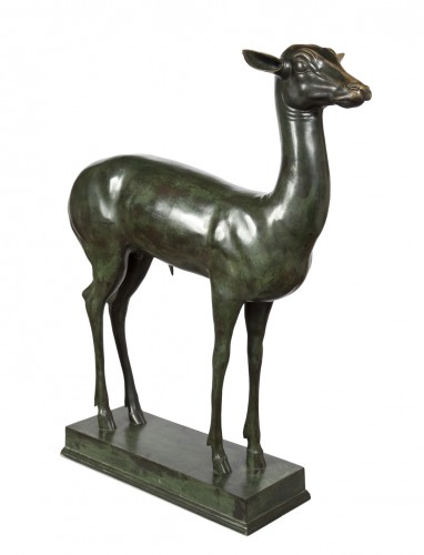 An elegant bronze sculpture of a Fawn 